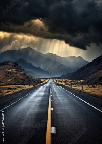 Road to mountain with heavy clouds.
