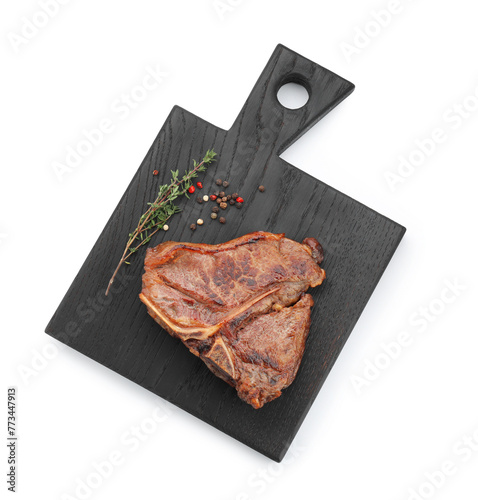 Delicious fried beef meat, thyme and peppercorns isolated on white, top view