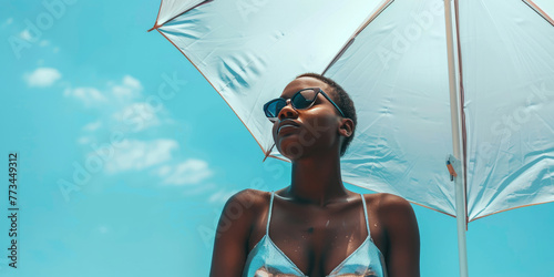 Wallpaper Mural A dark-skinned girl in a shiny swimsuit on an azure background. Rest and relaxation illustration Torontodigital.ca