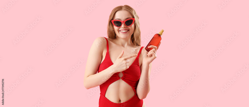 Beautiful young woman with sunscreen cream on pink background - obrazy, fototapety, plakaty 