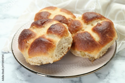 Hot cross buns on white marble table