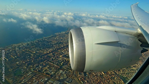 view window airplane wing engine jet flying trip Barcelona city county vacations
