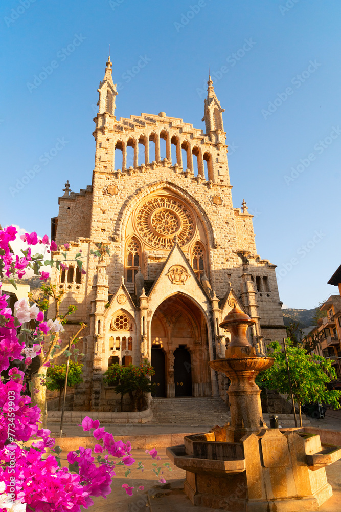 cathedral church in old town of Soller, Spain with flowers