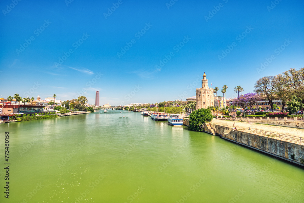 Golden Tower (Torre del Oro) with Guadalquivir River in Seville during a Sunny Day, Andalusia