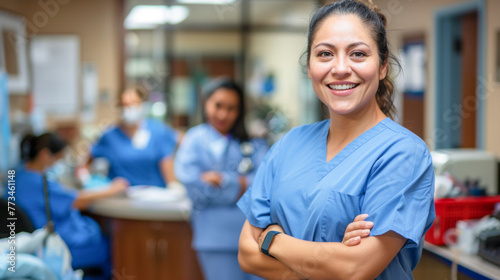 Confident Female Healthcare Worker in Blue Scrubs Smiling