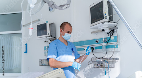 Hospital specialist in mask checking equipment. Medical professional specialist portrait.
