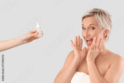 Surprised mature woman and ...