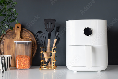 White Mini Air Fryer for Cooking WIthout Oil. Concept of White Kitchen Healthy Cooking
