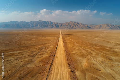 Solitary Desert Road Stretch Vie, road adventure, path to discovery, holliday trip, Aerial view