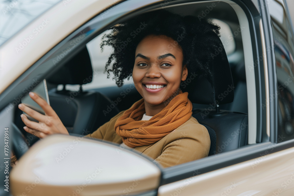 Smiling young woman sitting behind the wheel with a phone. Happy lifestyle. Smiling young woman sitting behind the wheel with a phone. Happy lifestyle.