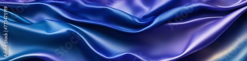 Blue panoramic silk background, fabric with blurred satin wavy texture. 