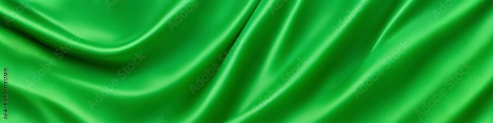 Light green panoramic silk fabric background in bright pastel colors with blurred satin wavy texture. Light green panoramic silk fabric background in bright pastel colors with blurred satin wavy texture.