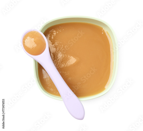 Tasty baby food in bowl and spoon isolated on white, top view