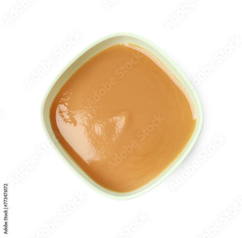 Tasty baby food in bowl isolated on white, top view