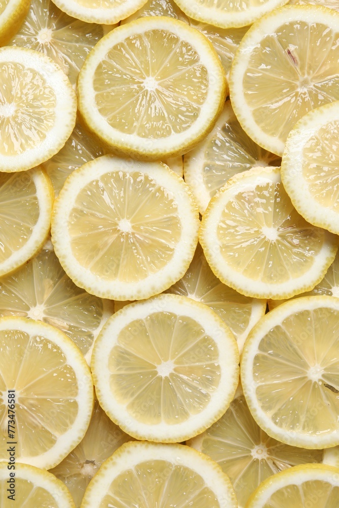 Slices of fresh lemons as background, top view Slices of fresh lemons as background, top view