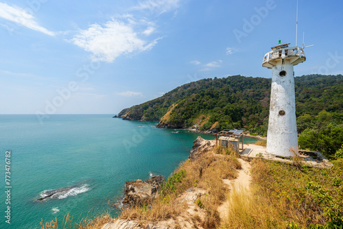 Scenic view of a lighthouse on a cliff at the Mu Ko Lanta National Park in Koh Lanta  Thailand  on a sunny day.
