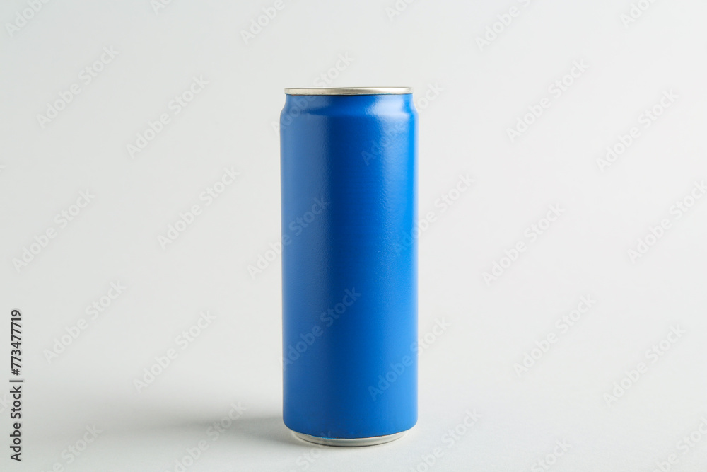 Energy drink in blue can on light grey background Energy drink in blue can on light grey background