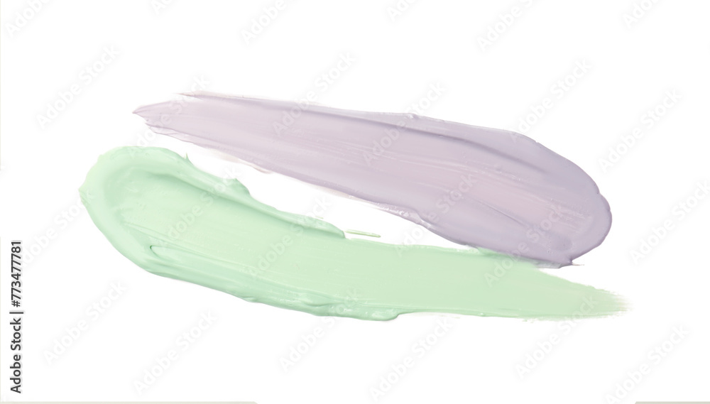 Strokes of green and purple color correcting concealers isolated on white, top view