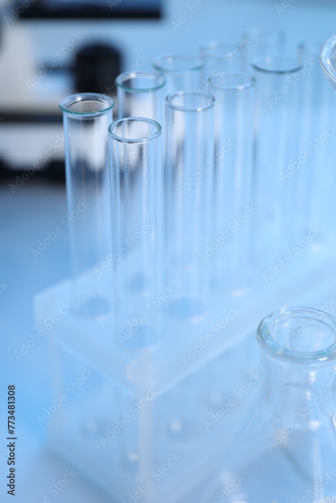 Laboratory analysis. Different glassware on white table, closeup Laboratory analysis. Different glassware on white table, closeup