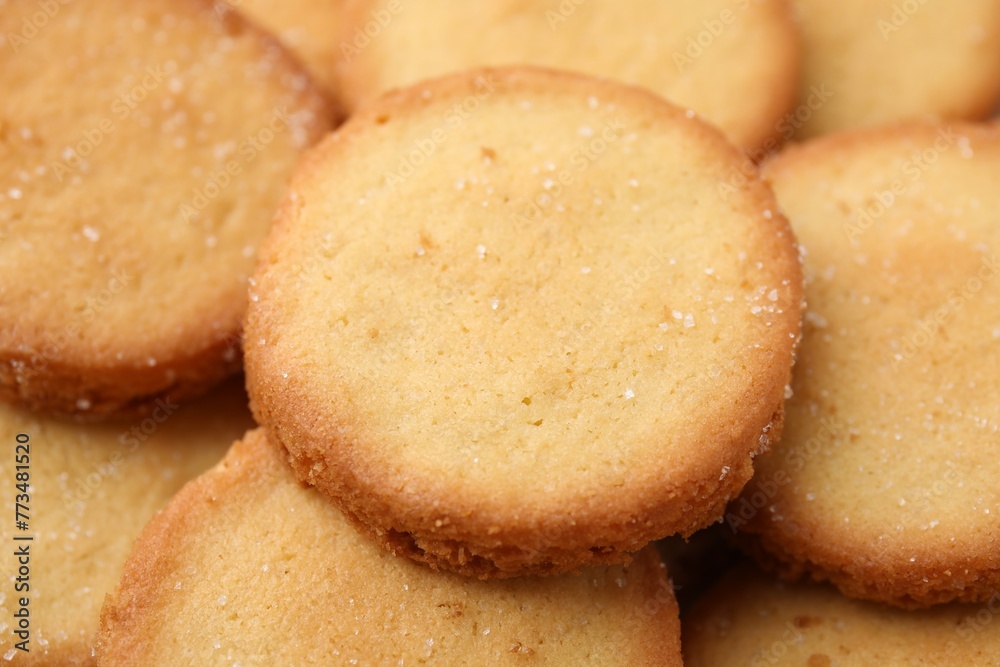 Tasty sweet sugar cookies as background, closeup