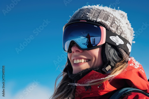 woman in ski goggles and winter equipment