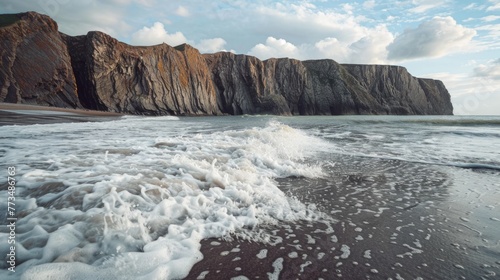 Powerful waves crashing onto sandy beach, ideal for travel brochures