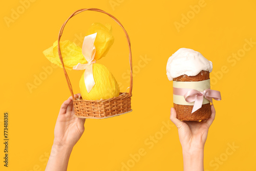 Hands holding easter basket...