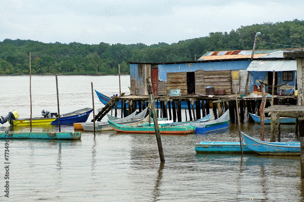 Boats moored in front of wooden shacks in Limones, Esmereldas, Ecuador