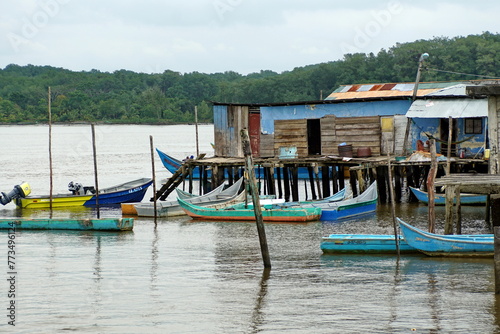 Boats moored in front of wooden shacks in Limones, Esmereldas, Ecuador