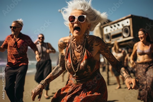Stylish very old lady in is dancing at a beach open air summer party. Grandmother in eyeglasses with white hair. Active aging concept.
