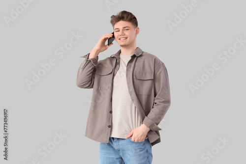 Young man talking by mobile...