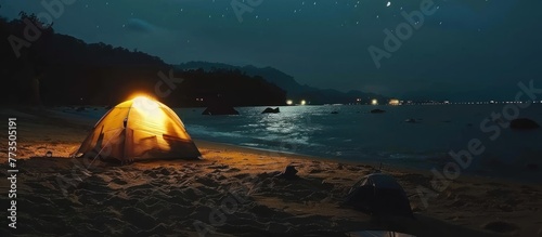Portrait of camping on the beach using a tent at night