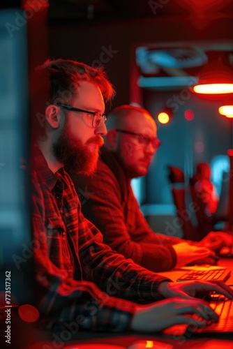 Two men sitting in front of a computer. Suitable for business concept