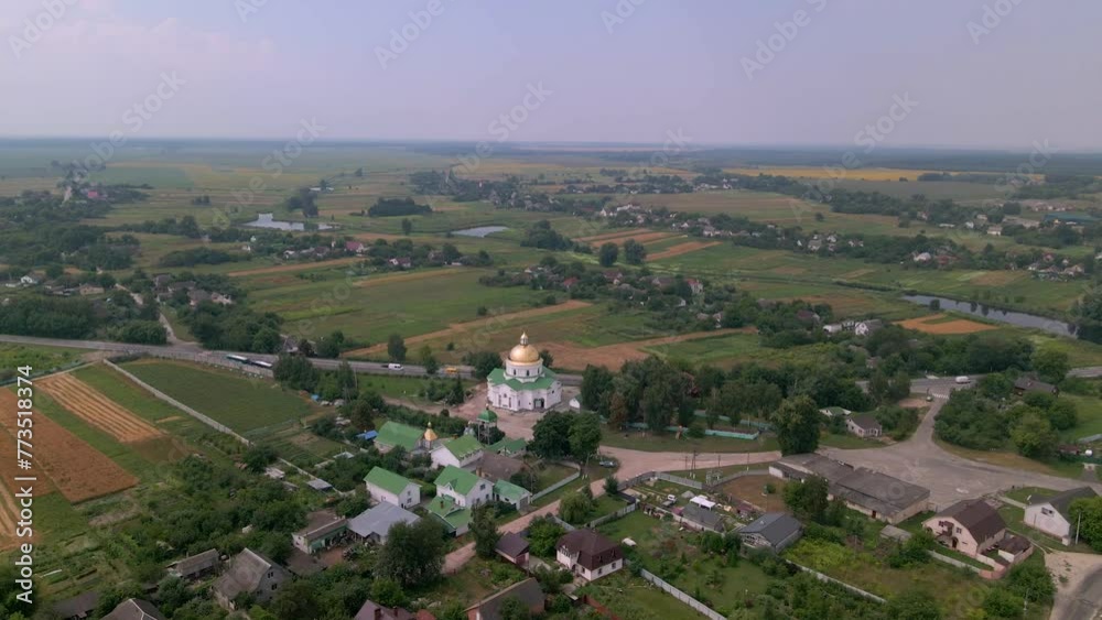 Drone flies over small church in european village Drone flies over small church in european village