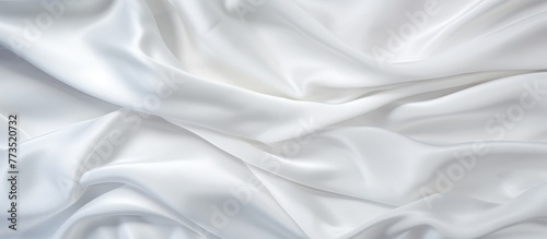 A close up of a white fabric featuring a vast array of intricate folds creating a textured pattern