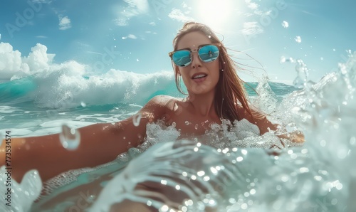 Glamorous summer vacation with beautiful woman taking selfie shot in sea waves