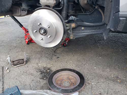 Old and new brake disc of the car brake system.