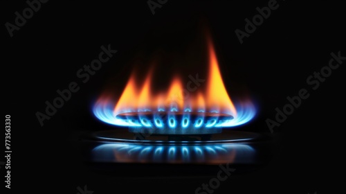 Gas burner flame on black, orange tongues of blue flame of a gas burner, high quality.
