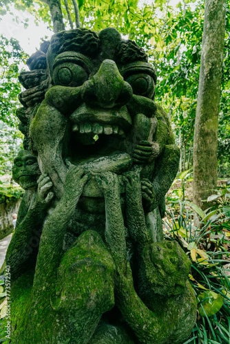 Monkey statues in Monkey Forest, Ubud, Bali, Indonesia. © Zenstratus