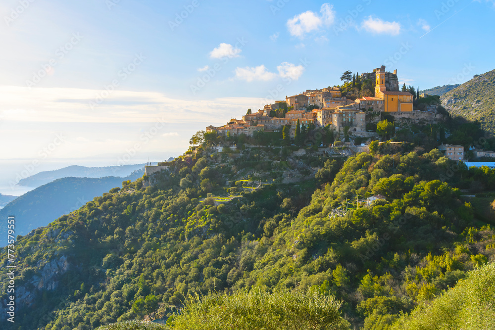 View of the Mediterranean sea and hilltop Eze, France, from the Grand Corniche road or highway that runs along the Cote d'Azur French Riviera.	
