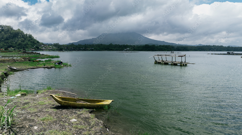 Canoes on Danau Batur lake in the caldera of Mount Batur, Kintamani, Bali, Indonesia. Canoes on Danau Batur lake in the caldera of Mount Batur, Kintamani, Bali, Indonesia.