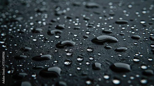 raindrops and white sparkling specks on black background