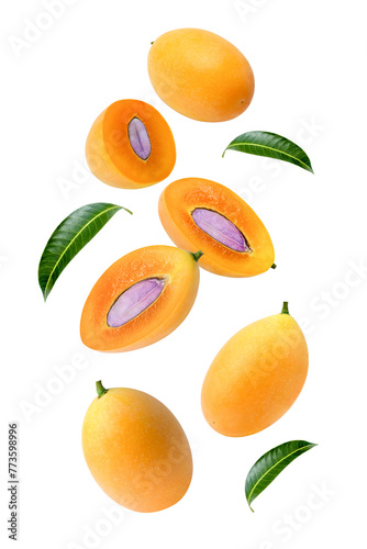 фотографія Fresh Marian plum (plum mango) with leaf flying in the air isolated on white background