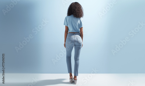 Fictional female model showing jeans from behind in blue theme; tall heels background image