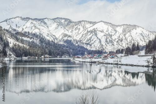 Panoramic Winter View Of Tadami Railway Line Train And Bridge Reflection In The Beautiful Valley Of Tadami River, Mishima Machi, Aizu Kawaguchi, Fukushima, Japan