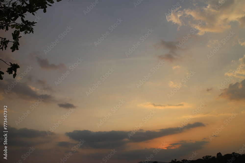 Colorful cloudy sky at sunset. golden color. Sky texture, abstract nature background