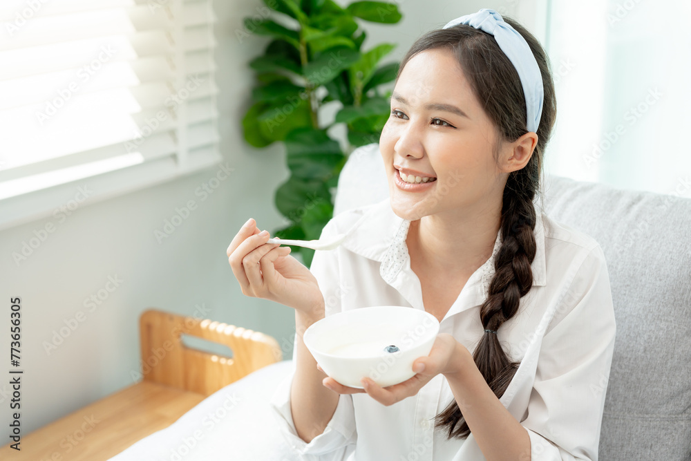 healthy food. Beautiful female girl enjoy eat yogurt, granola, fresh fruits on breakfast health in house. Happy young woman smile on morning good emotion. dieting, detox, diet, clean eat, vegetar healthy food. Beautiful female girl enjoy eat yogurt, granola, fresh fruits on breakfast health in house. Happy young woman smile on morning good emotion. dieting, detox, diet, clean eat, vegetar