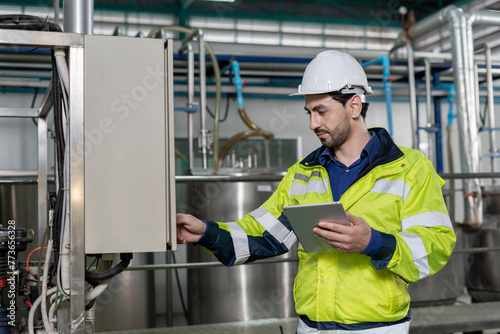 Engineers or factory managers wearing safety helmet inspect the machines in the production line. Utility inspector check machine and test the system to meet the standard. machine, maintenance.