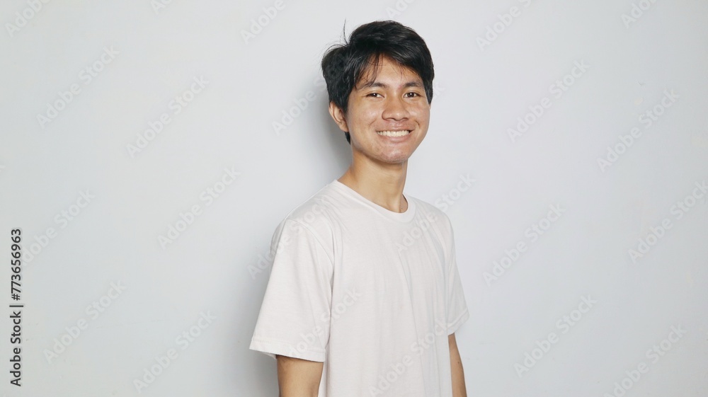 Handsome Asian young man smiling casual and cool pose Handsome Asian young man smiling casual and cool pose