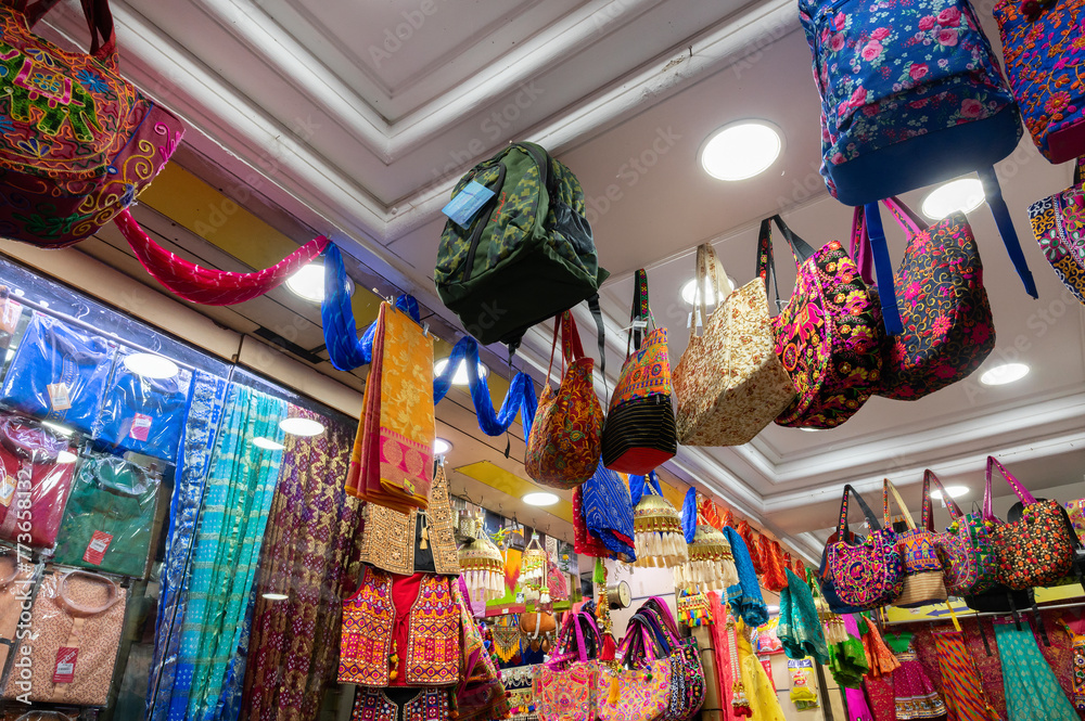 Jodhpur, Rajasthan, India - 15.10.2019 : .Colorful Rajasthani ladies bags are displayed for sale at famous Sardar Market and Ghanta ghar Clock tower market. Famous market place for tourists.